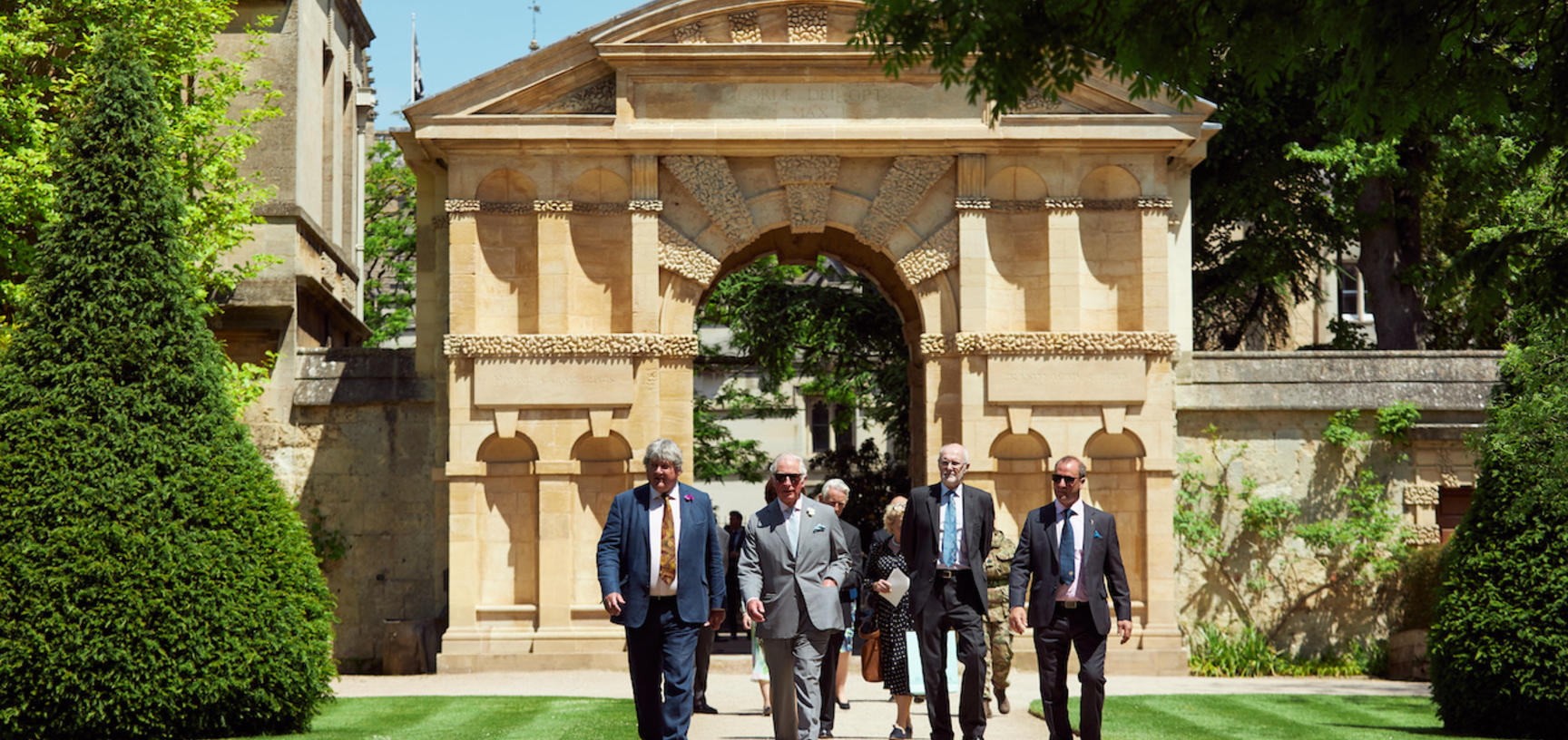 HM King Charles III and Oxford Botanic Garden staff with the Danby Gate behind them