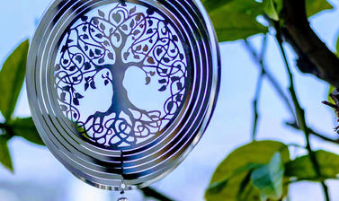 Chakra meditation, ornament hanging from tree photo by Lavi perchik unsplash