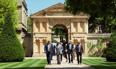 HM King Charles III and Oxford Botanic Garden staff with the Danby Gate behind them