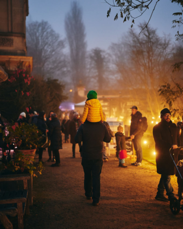 Crowds assemble at the Christmas Fair on a winter's evening